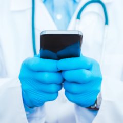 Doctor Playing Smartphone